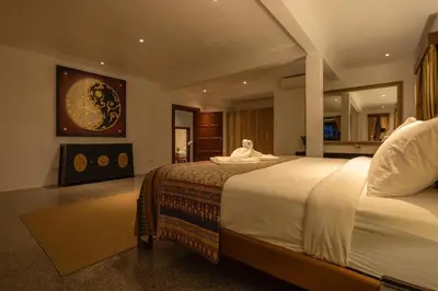 a bedroom with a large bed in a room at Private beachfront Villa Natai with 5 bedrooms in Ban Na Tai