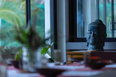a statue of a head sitting on a table at Private beachfront Villa Natai with 5 bedrooms in Ban Na Tai