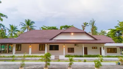 a house with a red roof at Private beachfront Villa Natai with 5 bedrooms in Ban Na Tai