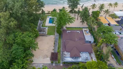 an aerial view of a house next to the beach at Private beachfront Villa Natai with 5 bedrooms in Ban Na Tai