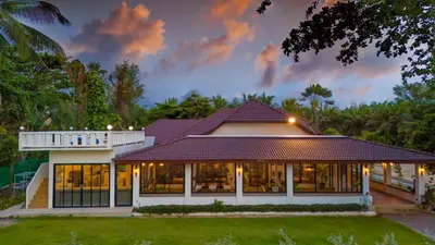 a house with a lot of windows at Private beachfront Villa Natai with 5 bedrooms in Ban Na Tai