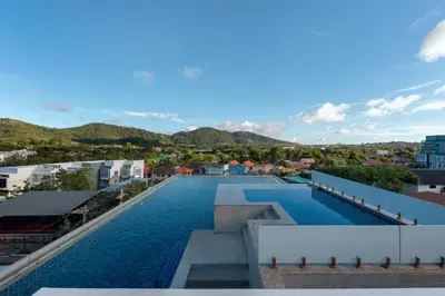 a swimming pool on the roof of a building at Relife Apartments by Tropiclook - Fast WiFi , Pool and Gym in Phuket Town