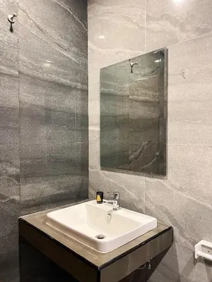 a bathroom with a sink and a mirror at The Passion House in Ban Na Nai