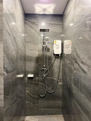 a shower in a bathroom with a glass wall at The Passion House in Ban Na Nai
