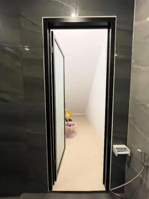 a mirror in a bathroom with a walk in shower at The Passion House in Ban Na Nai