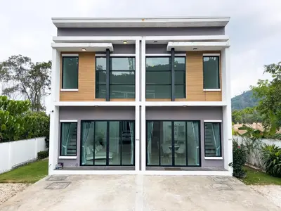 a house with large windows on a driveway at The Passion House in Ban Na Nai