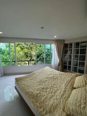 a bedroom with a large bed in front of a window at Sea view Karon Butterfly 2 bdr in Karon Beach