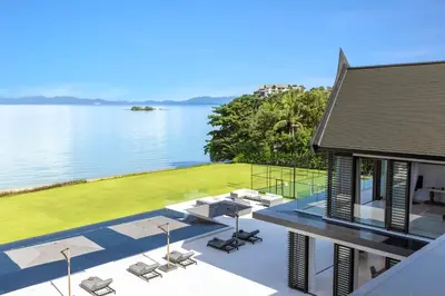an aerial view of a house with a view of the water at Villa Amarasara in Phuket Town