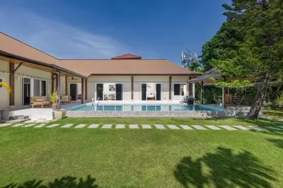 a house with a swimming pool in a yard at Villa Emilia Private Pool Naiharn in Rawai Beach