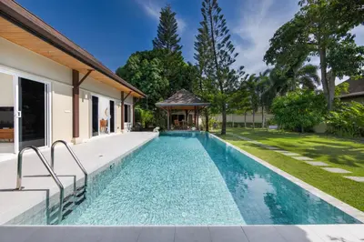 a swimming pool in the backyard of a house at Villa Emilia Private Pool Naiharn in Rawai Beach