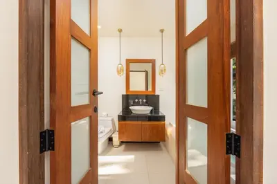 a bathroom with a sink and a mirror at Villa Emilia Private Pool Naiharn in Rawai Beach
