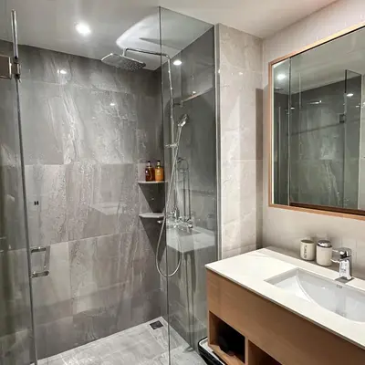 a bathroom with a shower and a sink at 1 bdr Mountain View Apartment 50 m from Bangtao Beach in Bang Tao Beach