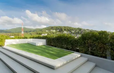 a view from the roof of a house with a lawn at 6th avenue surin in Surin Beach