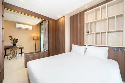 a bedroom with a large white bed in a room at Tropical Stay at Apartment B603 in VV Patong in Patong Beach