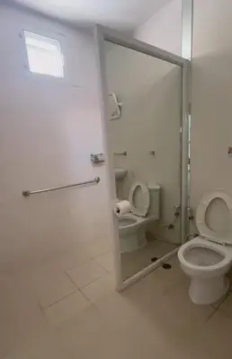 a bathroom with a toilet and a glass shower door at Superb 3 Bed Pool Villa in Ban Saiyuan (1)