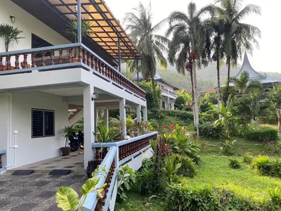 a view of a house with a balcony at The Vintage Kamala in Kamala Beach