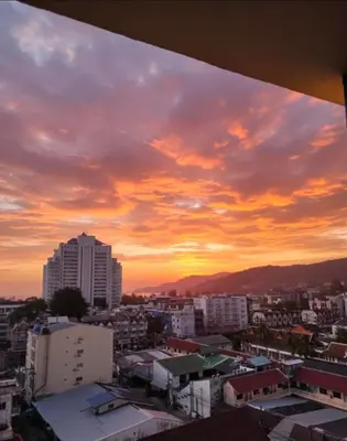 a view of a city at sunset at Monkey apartment 6 in Patong Beach
