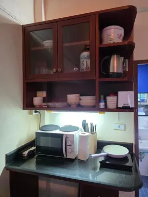 a kitchen with a counter top with a microwave at Monkey apartment 6 in Patong Beach