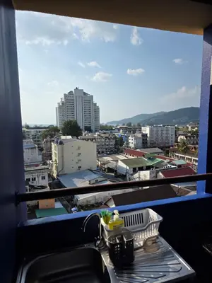 a view of a city from a balcony with a sink at Monkey apartment 6 in Patong Beach