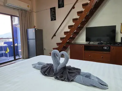 a room with a bed with a towel on it at Monkey apartment 6 in Patong Beach