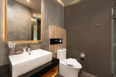 a bathroom with a white sink and a toilet at Relife Sol 2 min to Nai Harn beach by TropicLook in Rawai Beach