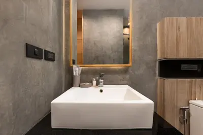 a bathroom with a white sink and a mirror at Relife Sol 2 min to Nai Harn beach by TropicLook in Rawai Beach
