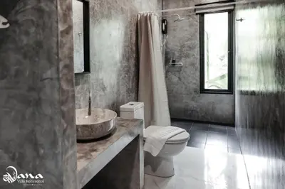 a bathroom with a sink and a toilet and a shower at Nana Villa in Ko Yao Noi
