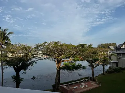 a view of a body of water with trees at Stunning Lake View One Bedroom in Laguna Phuket