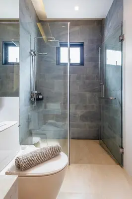 a bathroom with a glass shower and a toilet at Botanica Foresta B10 in Ban Nong Chaeng