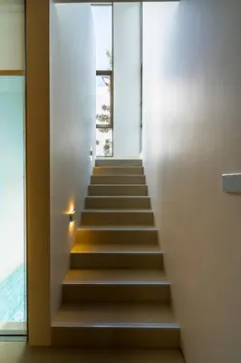 a staircase in a house with a window at Luxpride Villa by Wallaya Villas in Ban Thalat Choeng Thale