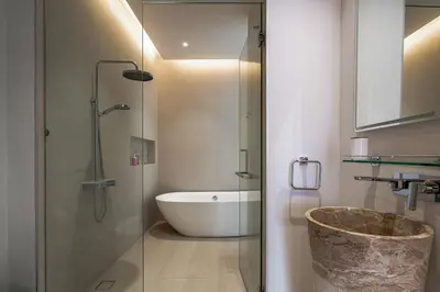 a bathroom with a bath tub and a sink at Luxpride Villa by Wallaya Villas in Ban Thalat Choeng Thale