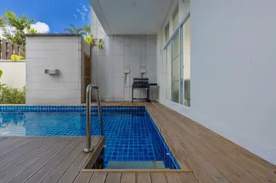 a swimming pool in the middle of a house at Villa Aura 3BR Private Pool Near Naiharn Beach by TropicLook in Rawai Beach