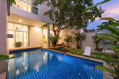 a swimming pool in the backyard of a house at Villa Aura 3BR Private Pool Near Naiharn Beach by TropicLook in Rawai Beach