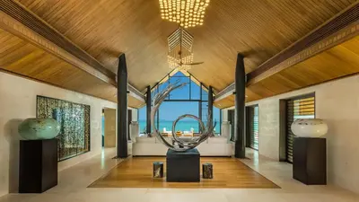 a museum with a sculpture in the middle of a room at Villa Amaravida in Ko Lek