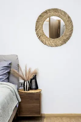 a bedroom with a bed and a mirror on the wall at Suite Azure 1BR Laguna Beachside Bang Tao Beach in Bang Tao Beach