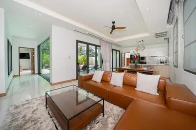 a living room with a couch and a table at 5 minutes from Laguna - Private Pool 3BR in Laguna Phuket