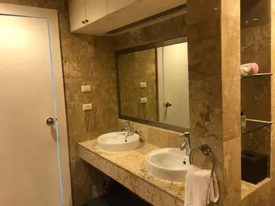 a bathroom with two sinks and a large mirror at Bel Air Panwa Big Apartment in south Phuket near Ao Yon Beach, 3rd floor in Ban Ao Makham