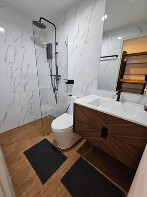 a bathroom with a sink and a toilet and a mirror at IKON STAY Zcape 2 Condominium S in Bang Tao Beach