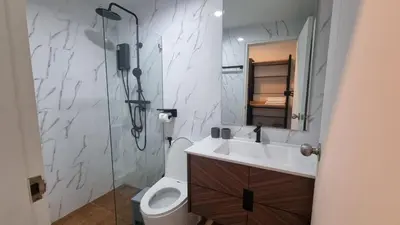 a bathroom with a sink and a toilet and a mirror at IKON STAY Zcape 2 Condominium S in Bang Tao Beach