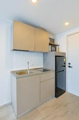 a kitchen with a sink and a refrigerator at Big Buddha View - 1 bedroom T3 - 228 in Chalong