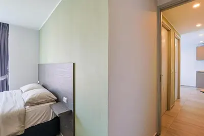 a bedroom with a bed and a wall at Big Buddha View - 1 bedroom T3 - 228 in Chalong