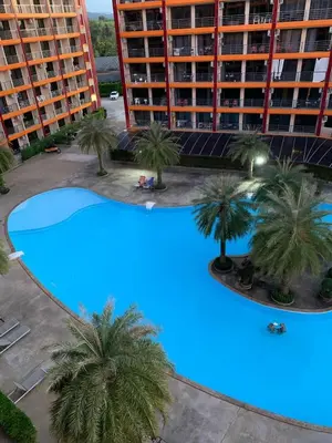 an overhead view of a large pool with palm trees at Pool View Tropic Studio in Ban Mai Salae