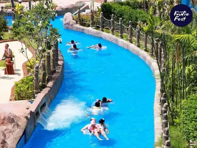 a group of people in a lazy river at a water park at Pool View Tropic Studio in Ban Mai Salae