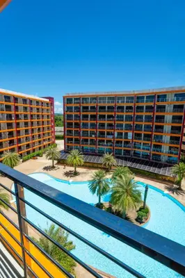 a view of two apartment buildings with a swimming pool at Pool View Tropic Studio in Ban Mai Salae