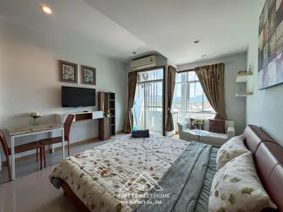 a bedroom with a bed and a desk and a table at Condo fodr rent The bell 50 in Ban Klang