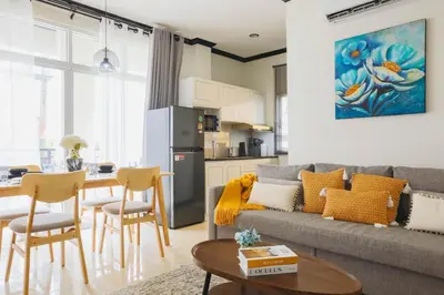 a living room with a couch and a table at Wink City 1 Patong Beach 4bedrooms in Patong Beach