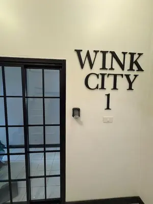 a sign on the side of a wall with the write city on it at Wink City 1 Patong Beach 4bedrooms in Patong Beach