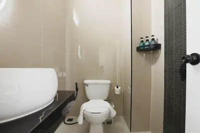 a bathroom with a toilet and a sink at Wink City 1 Patong Beach 4bedrooms in Patong Beach