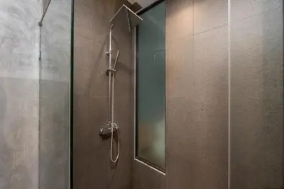 a shower in a bathroom with a glass door at Relife Kai 2 min to Nai Harn beach by TropicLook in Rawai Beach