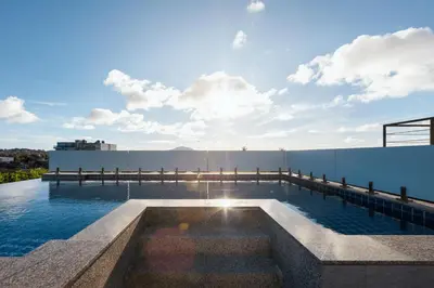 a swimming pool on the roof of a building at Relife Rio 2 min to Nai Harn beach in Rawai Beach